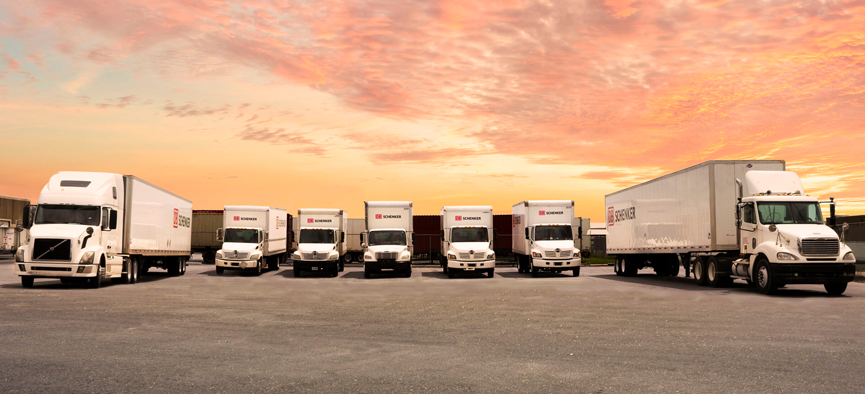 delivery man holding pile of cardboard boxes in front. copy space