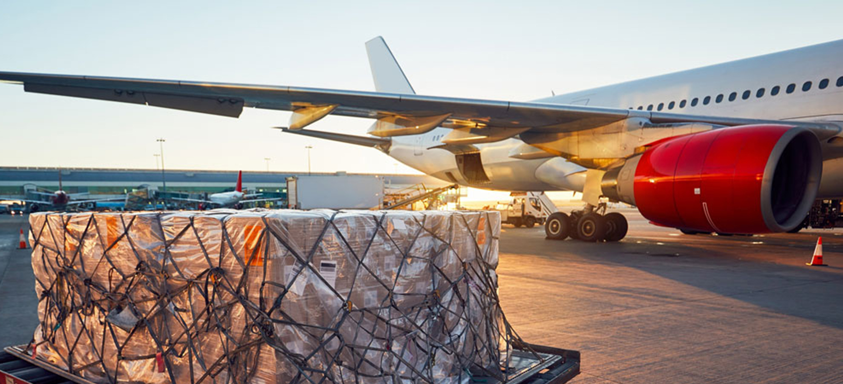 delivery man holding pile of cardboard boxes in front. copy space